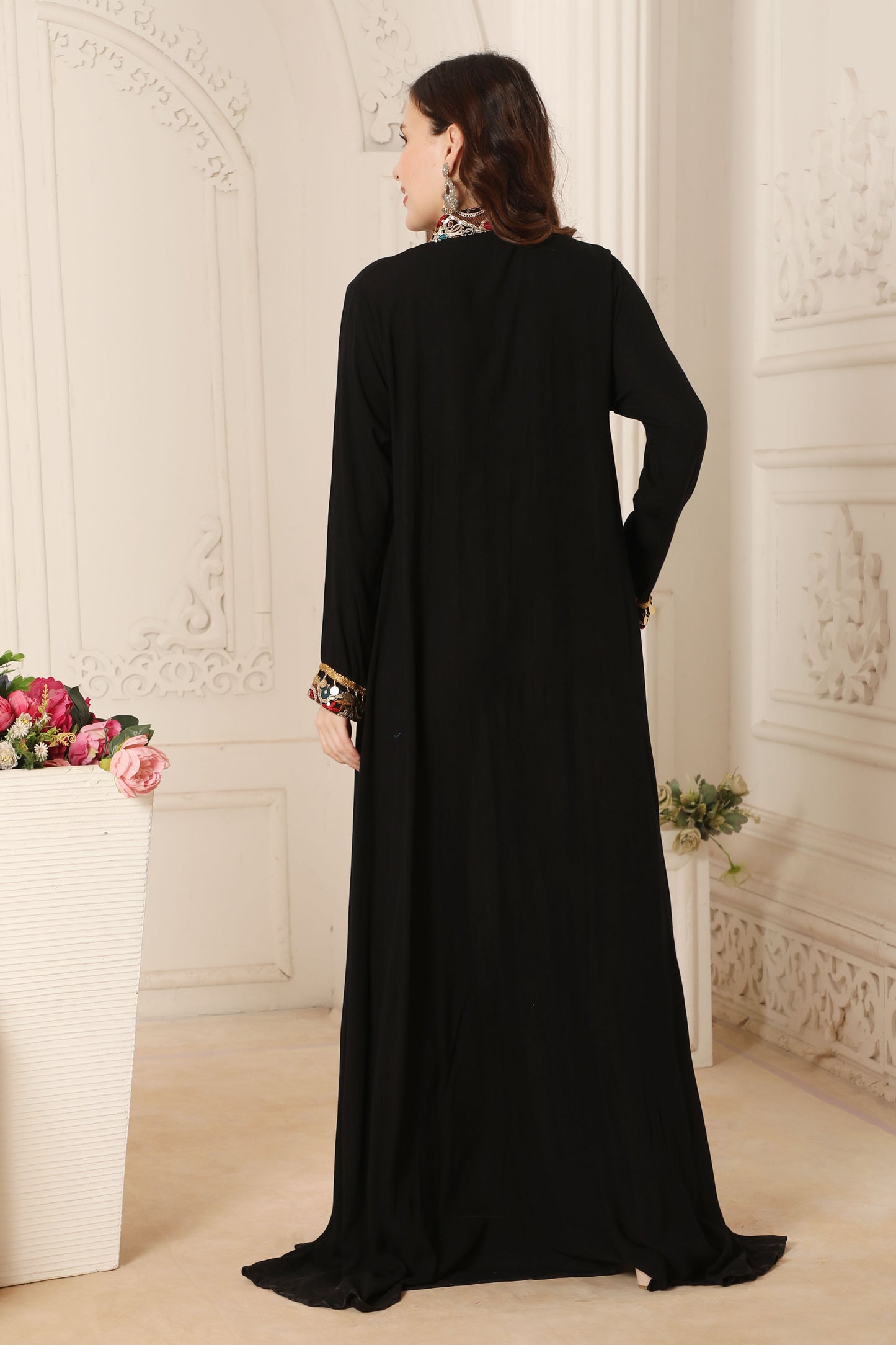 black embroidered long dress A sophisticated long black dress showcasing subtle floral embroidery Samant Chauhan